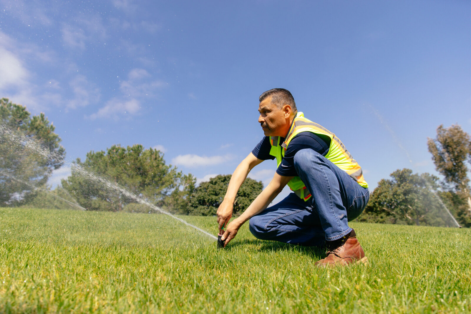 man managing a sprinkler